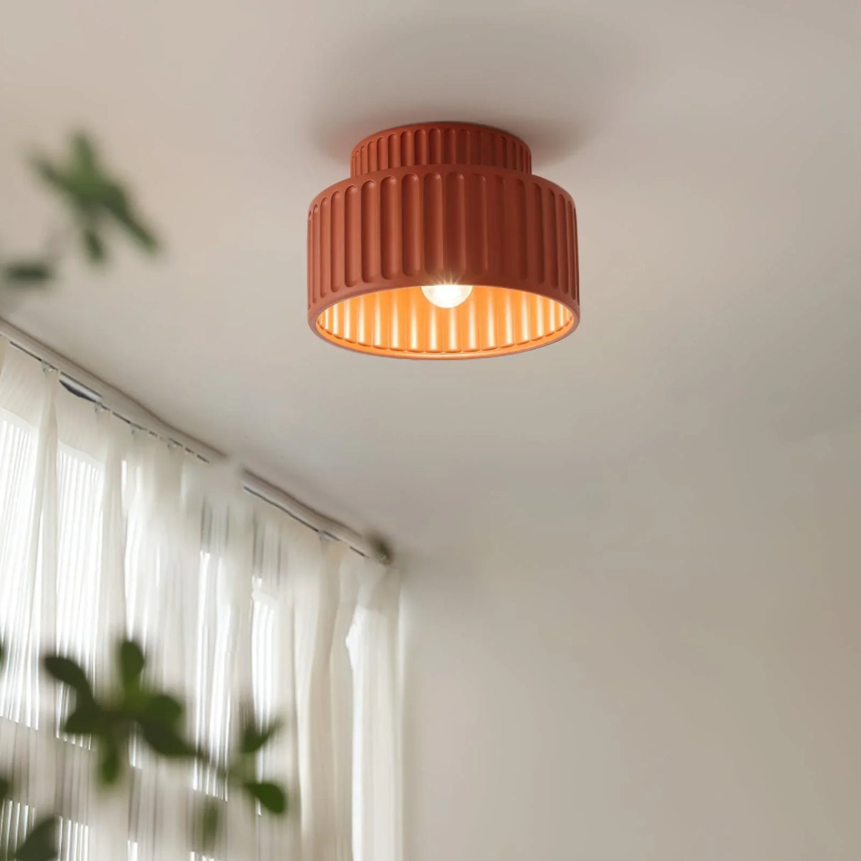 Semi flush mount ceiling light shown lit against a soft neutral studio background