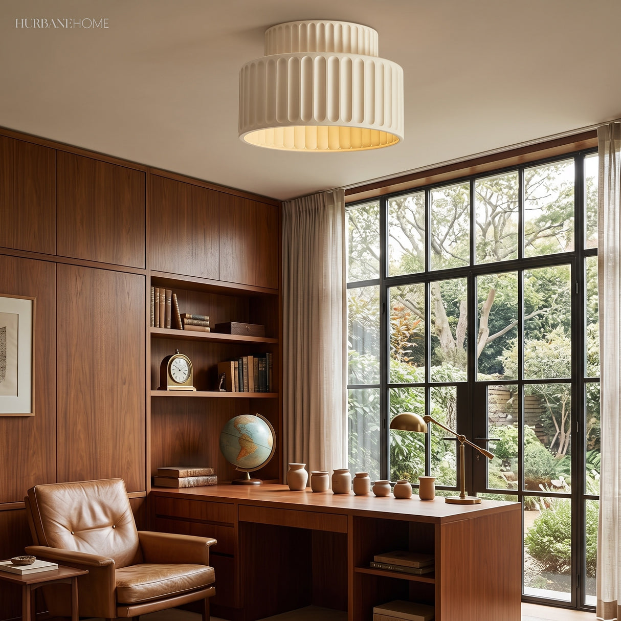 Cream fluted semi flush ceiling light glowing in a walnut-panelled study by a garden window