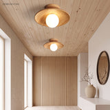 Wood ceiling lights fitted to a slatted timber hallway ceiling
