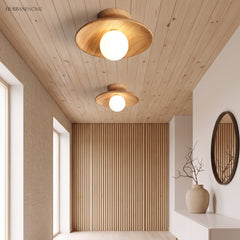 Wood ceiling lights fitted to a slatted timber hallway ceiling