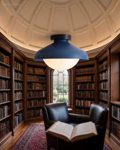 Blue dome ceiling light lit beneath the domed ceiling of a panelled library