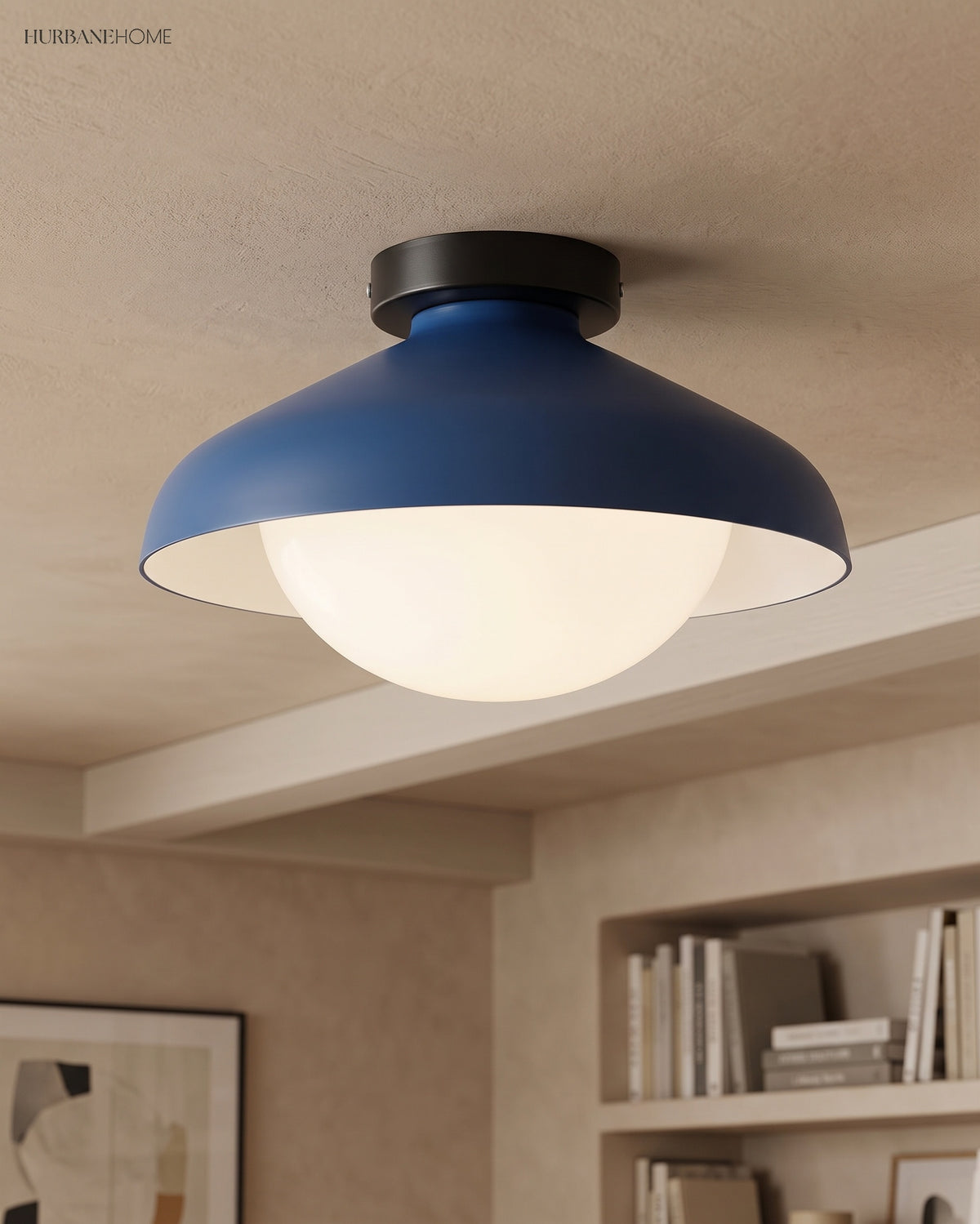 Blue dome ceiling light in a living room with artwork and open bookshelves