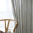 Sheer linen drapes flowing gently across wide balcony window