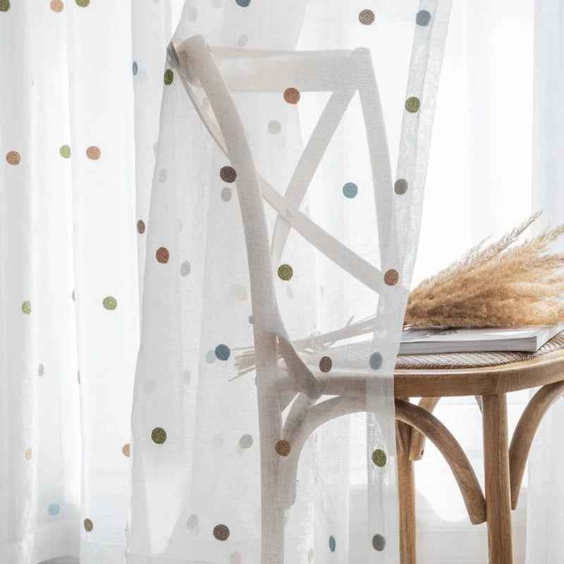 Sheer voile curtain pannel with colorful embroidery close-up detail