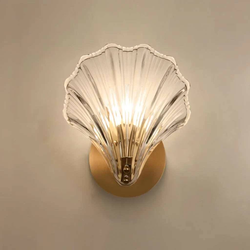 Amber shell sconce shown at an angle beside a plain neutral backdrop