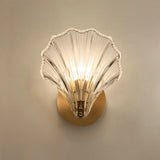 Amber shell sconce shown at an angle beside a plain neutral backdrop