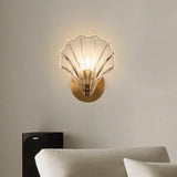 Amber shell glass wall sconce viewed straight on with the light off
