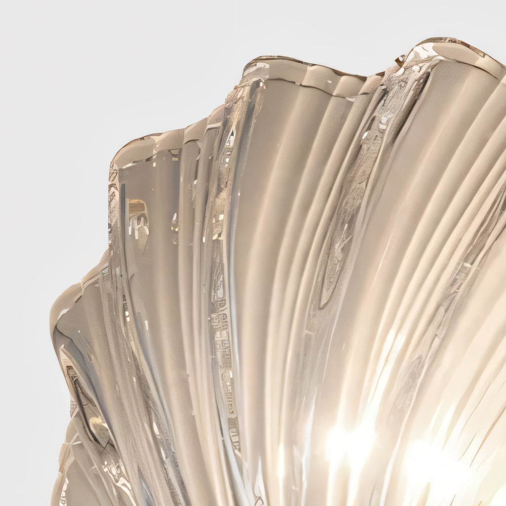 Close detail of the brass fittings and glass edge of the shell sconce