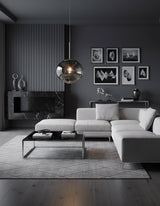 Silver molten pendant in a dark grey living room above a low marble table