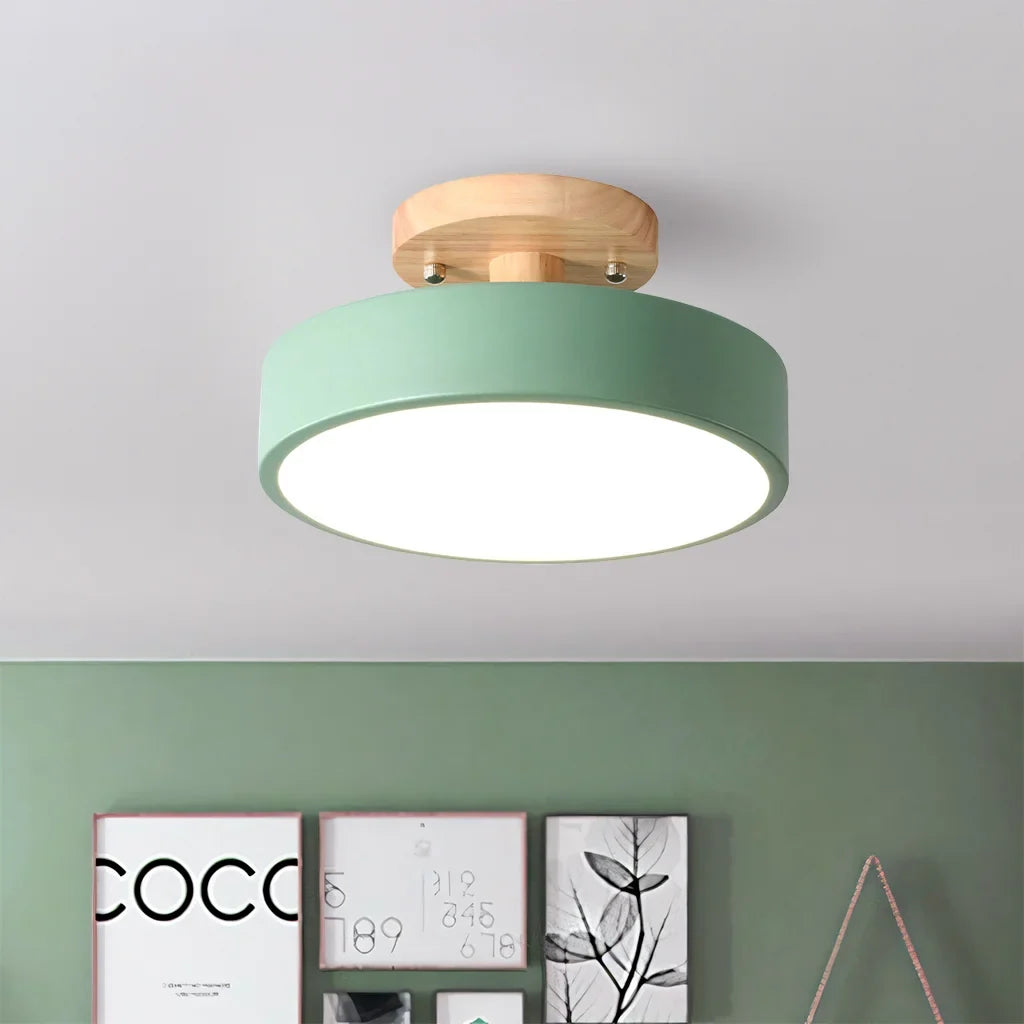 Gray macaron ceiling light shown against a plain studio background from below