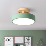 Gray macaron ceiling light shown against a plain studio background from below