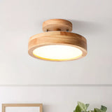 Pink macaron ceiling light shown against a plain studio background from below