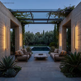 Linear lights along a covered terrace wall beside a pool and lounge seating