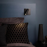 Switched LED wall sconce with a slim cylindrical head, black metal, view 4