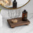 Small wooden bathroom tray styled with soap dispenser and accessories