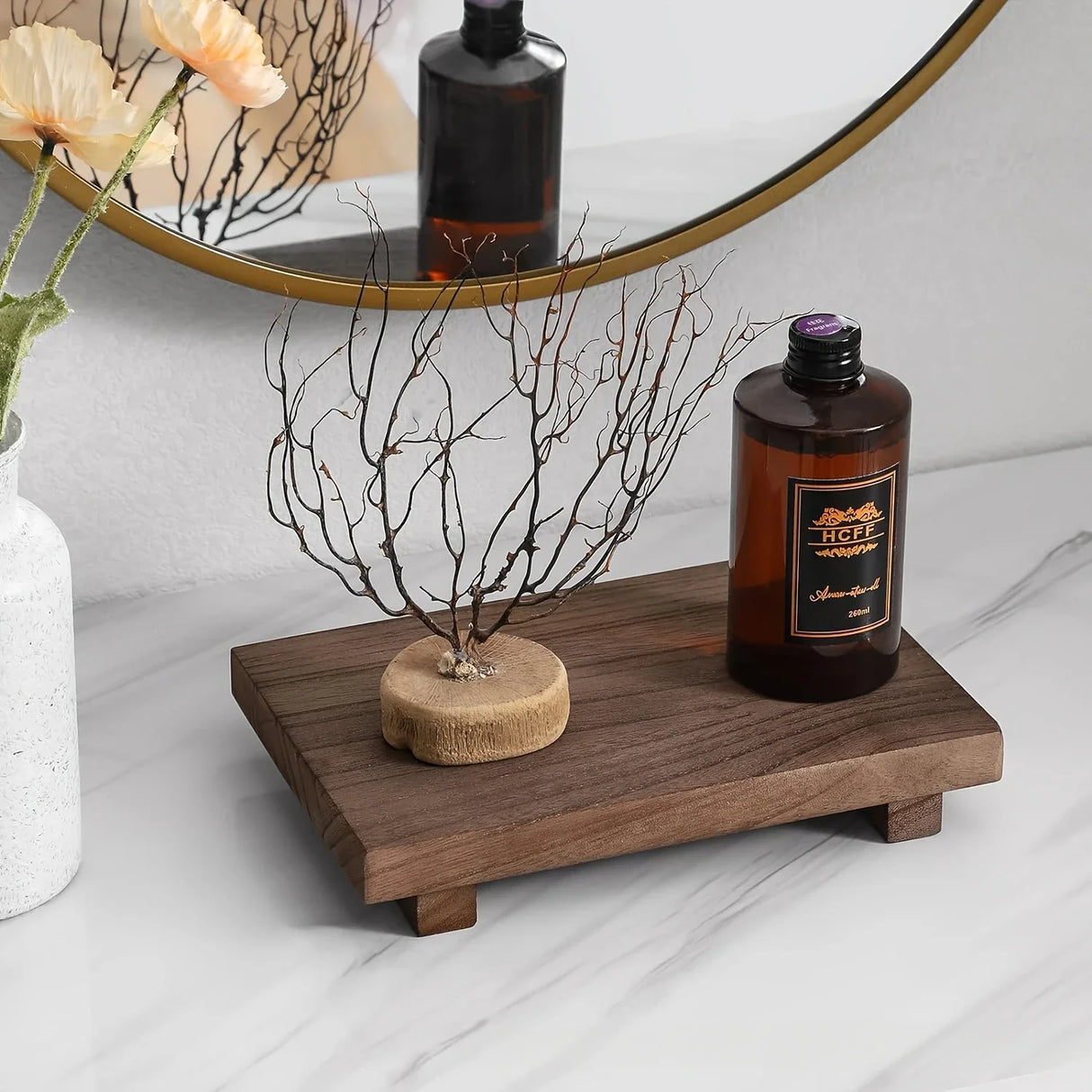 Small wooden bathroom tray styled with soap dispenser and accessories