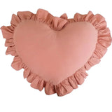 Plush ruffled accent designed as soft heart shaped pillow for bedroom