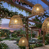 Solar bell lanterns hanging along a covered terrace at sunset