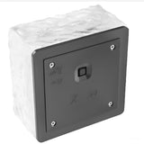 Underside of the cube light showing the black ABS base and push switch