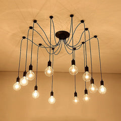 Spider chandelier with many bulbs lit against a warm brown backdrop