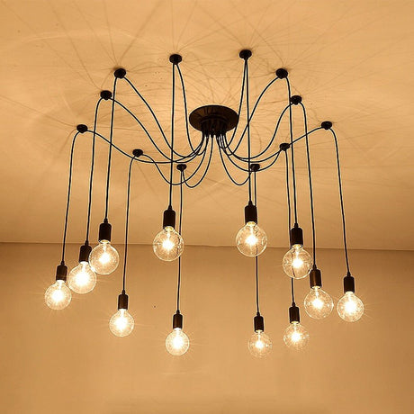 Spider chandelier with many bulbs lit against a warm brown backdrop