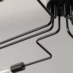 Close view of the stepped black iron arms and a bulb holder
