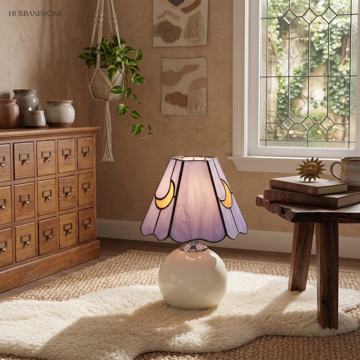 Lit stained glass lamp on a pale rug beside an apothecary chest of drawers