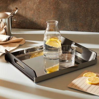 Modern stainless steel food tray styled on dining table
