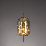 Amber glass pendant with a brass rod and dense starry LED filaments inside