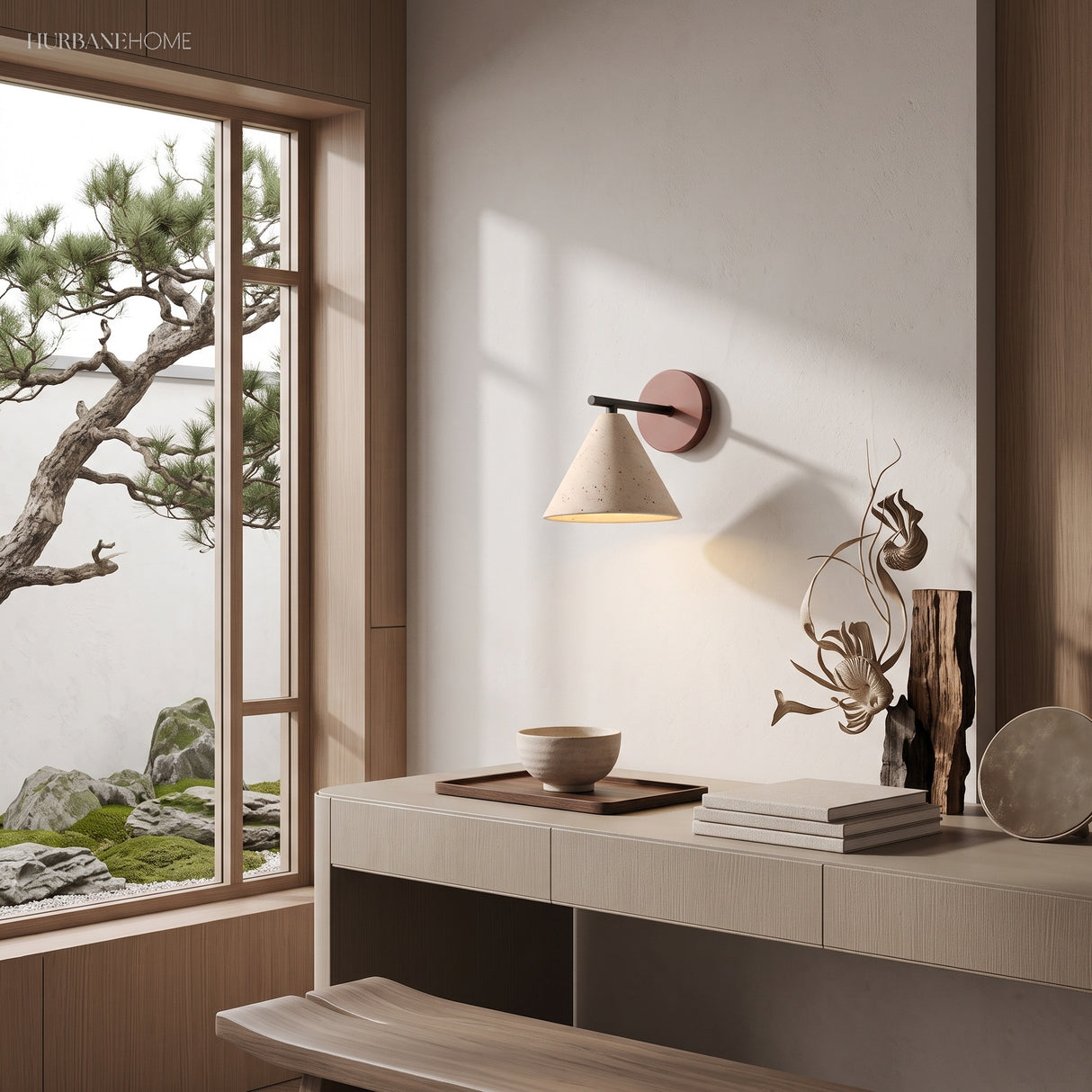 Stone cone wall light glowing beside a bright window and plants