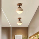 Stone dome semi flush mount light against neutral ceiling