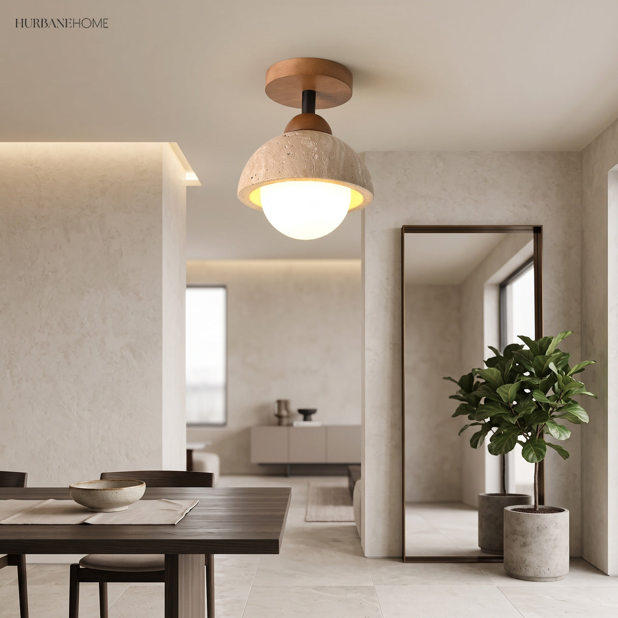 Stone dome ceiling light glowing over an open plan dining and living space