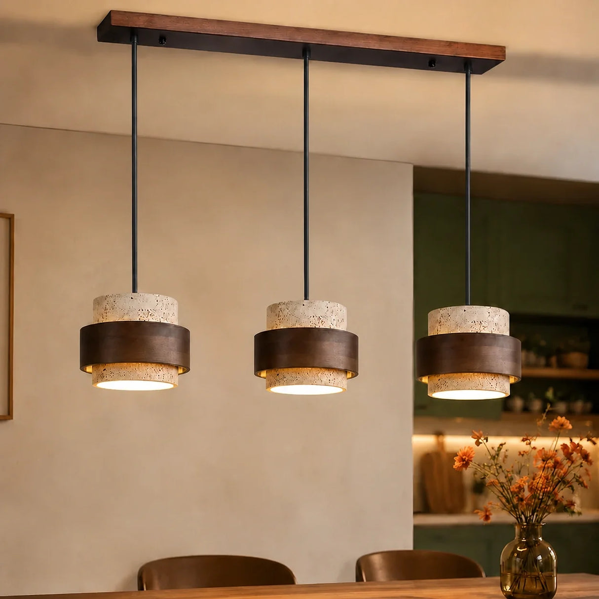 Beige travertine pendant light, three heads, angled white studio shot