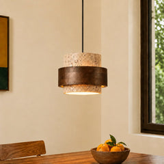 Beige stone pendant light, single head, on a dining room wall