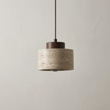 Short stone pendant with a dark walnut cap on a pale ground