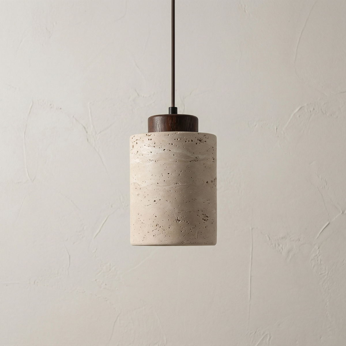 Tall stone cylinder pendant with a light wood cap on white