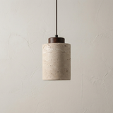 Tall stone cylinder pendant with a light wood cap on white