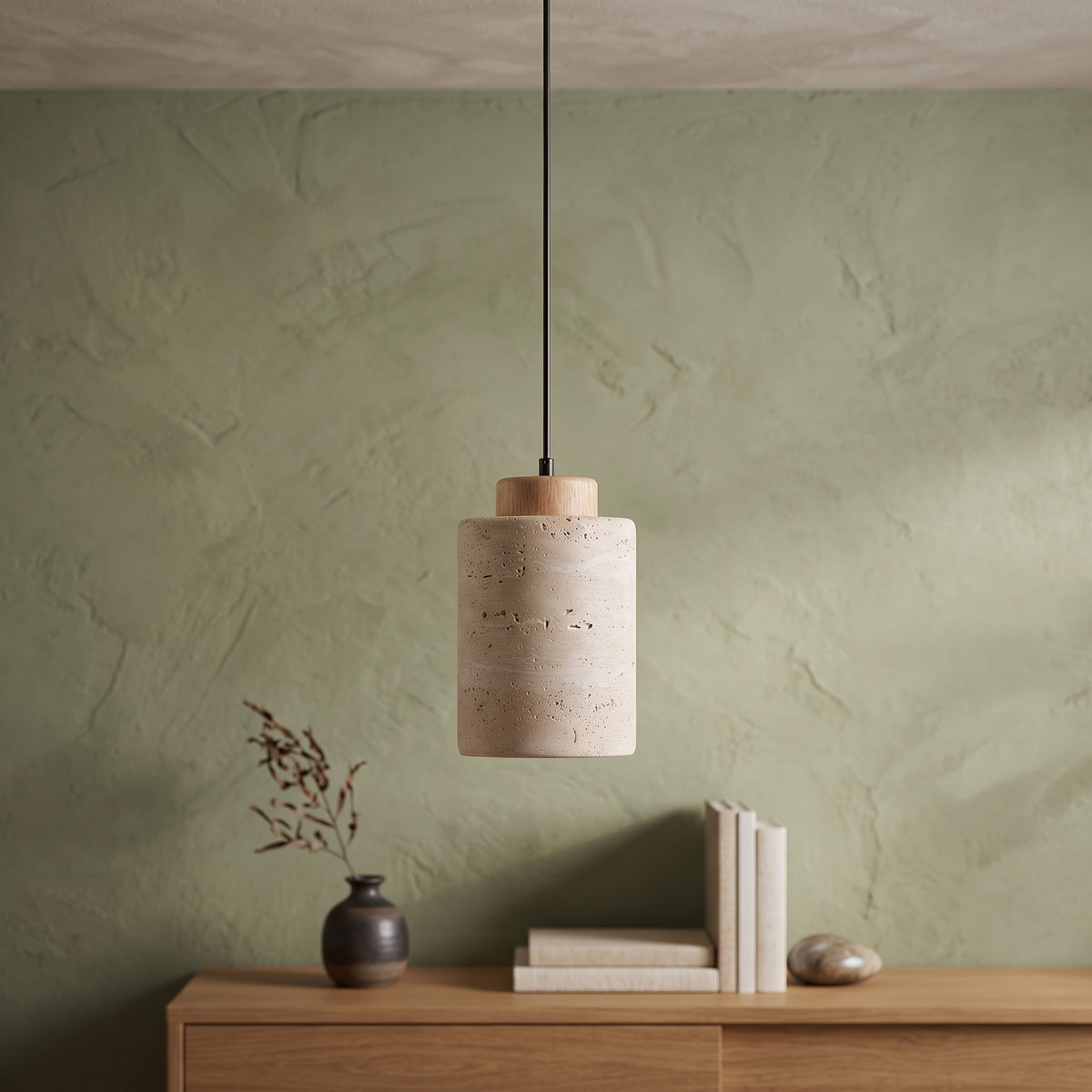 Stone cylinder pendant with a wood cap above a wooden console