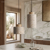 Two stone pendants at different heights above a marble worktop