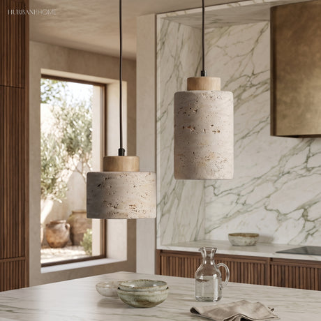 Two stone pendants at different heights above a marble worktop