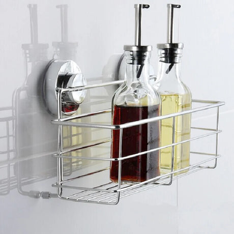 Suction cup corner shower caddy holding bottles on tile wall