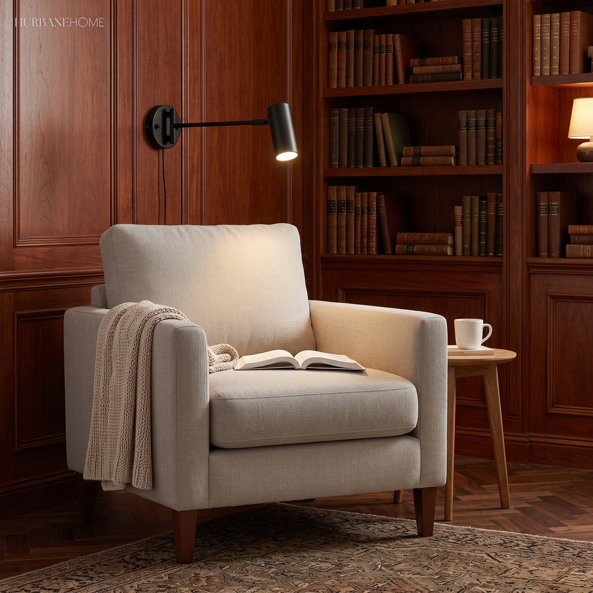 Black swing arm sconce lit over an armchair in a panelled library