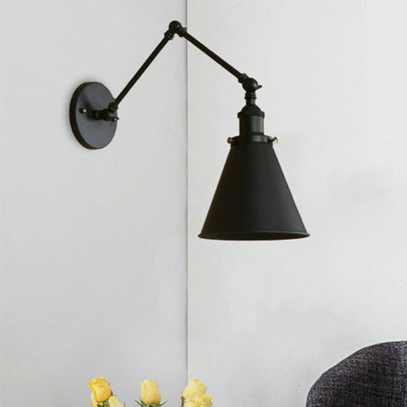 Black swing arm sconce mounted on a plain white interior wall
