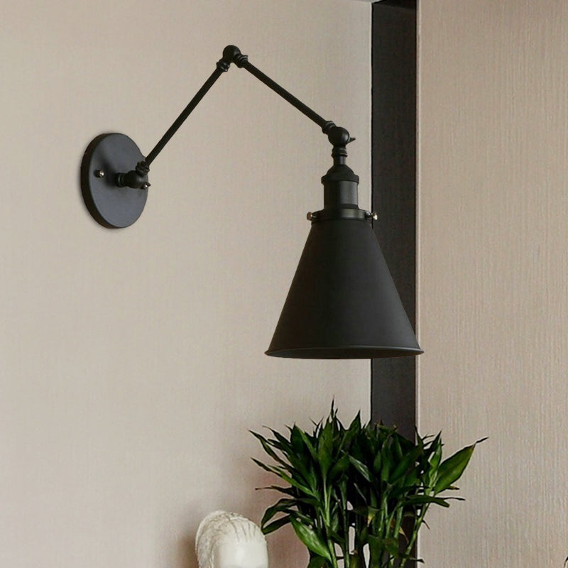 Black swing arm sconce beside a dark post and a potted plant