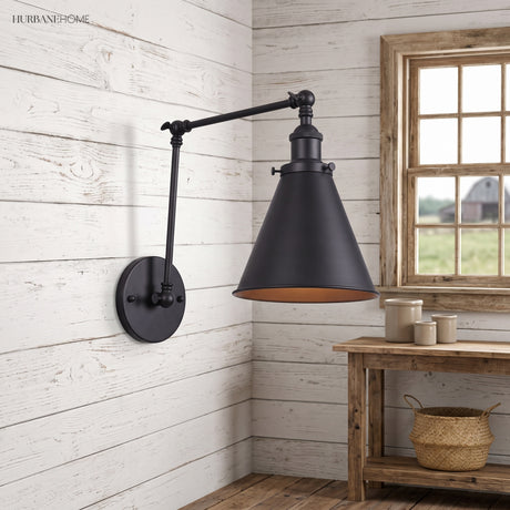Black swing arm sconce on white shiplap above a rustic side table
