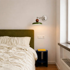 Side profile of adjustable swing arm wall sconce showing folding arm