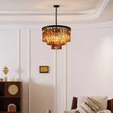 Full tiered crystal chandelier shown against a light neutral backdrop