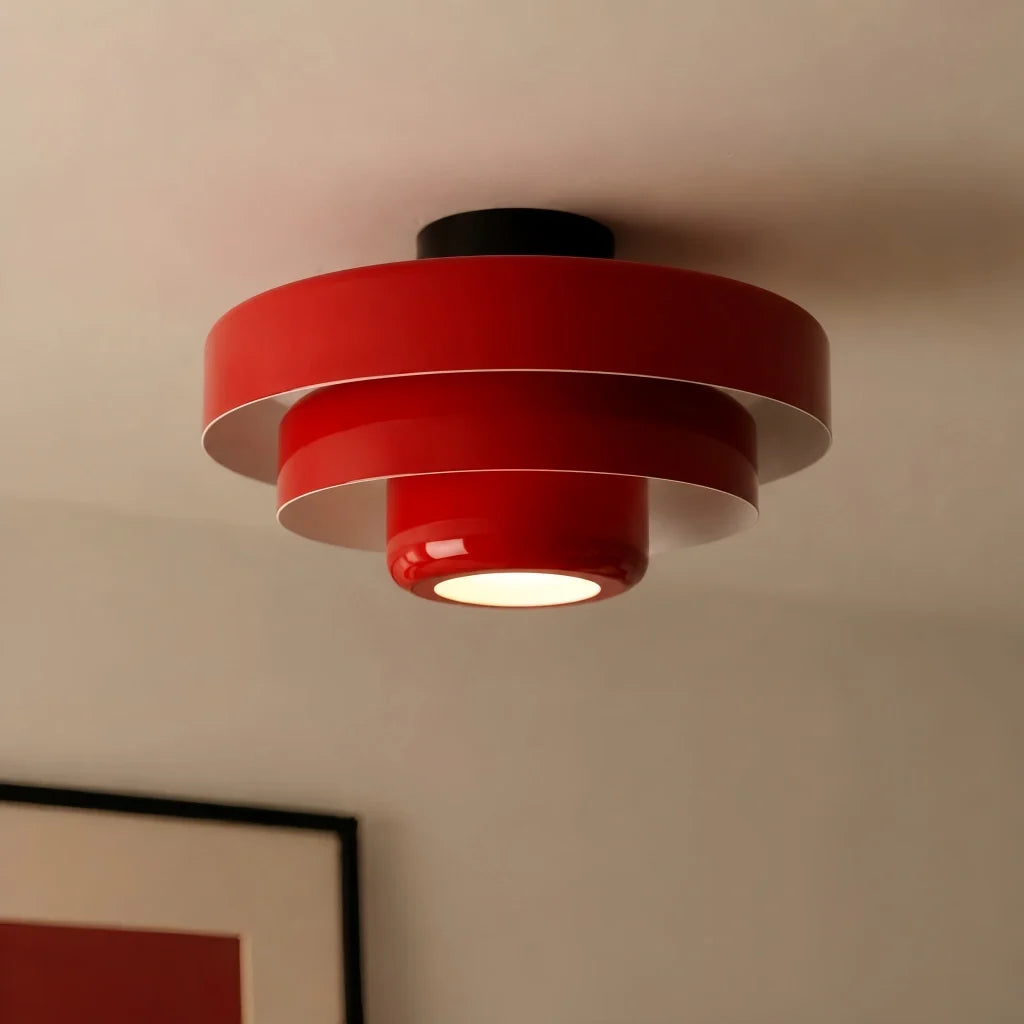 Angled studio view of the round tiered iron ceiling fixture