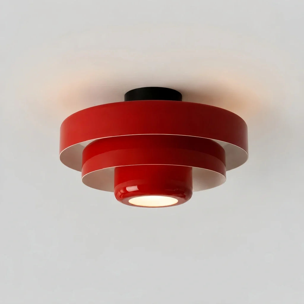 Studio shot of the orange three-tier round ceiling light on white