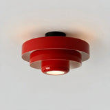 Studio shot of the orange three-tier round ceiling light on white